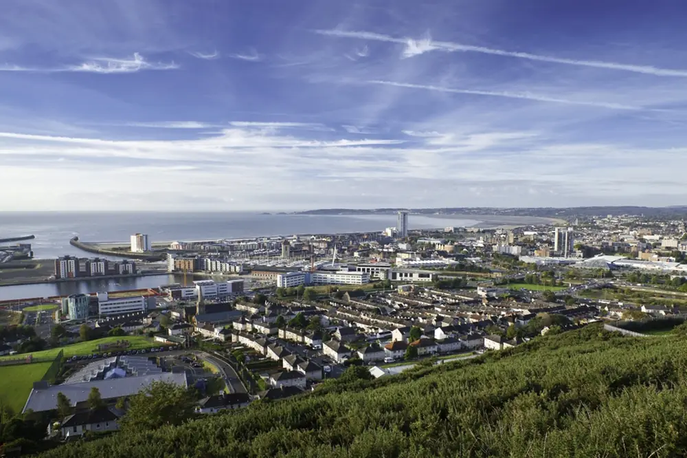 Swansea city centre and the bay seen from the hills above
