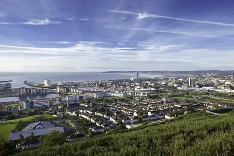 Swansea city centre and the bay seen from the hills above