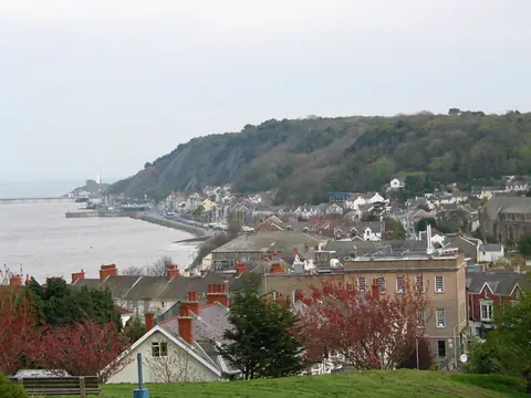 Houses on the hillside at Mumbles with the headland behind